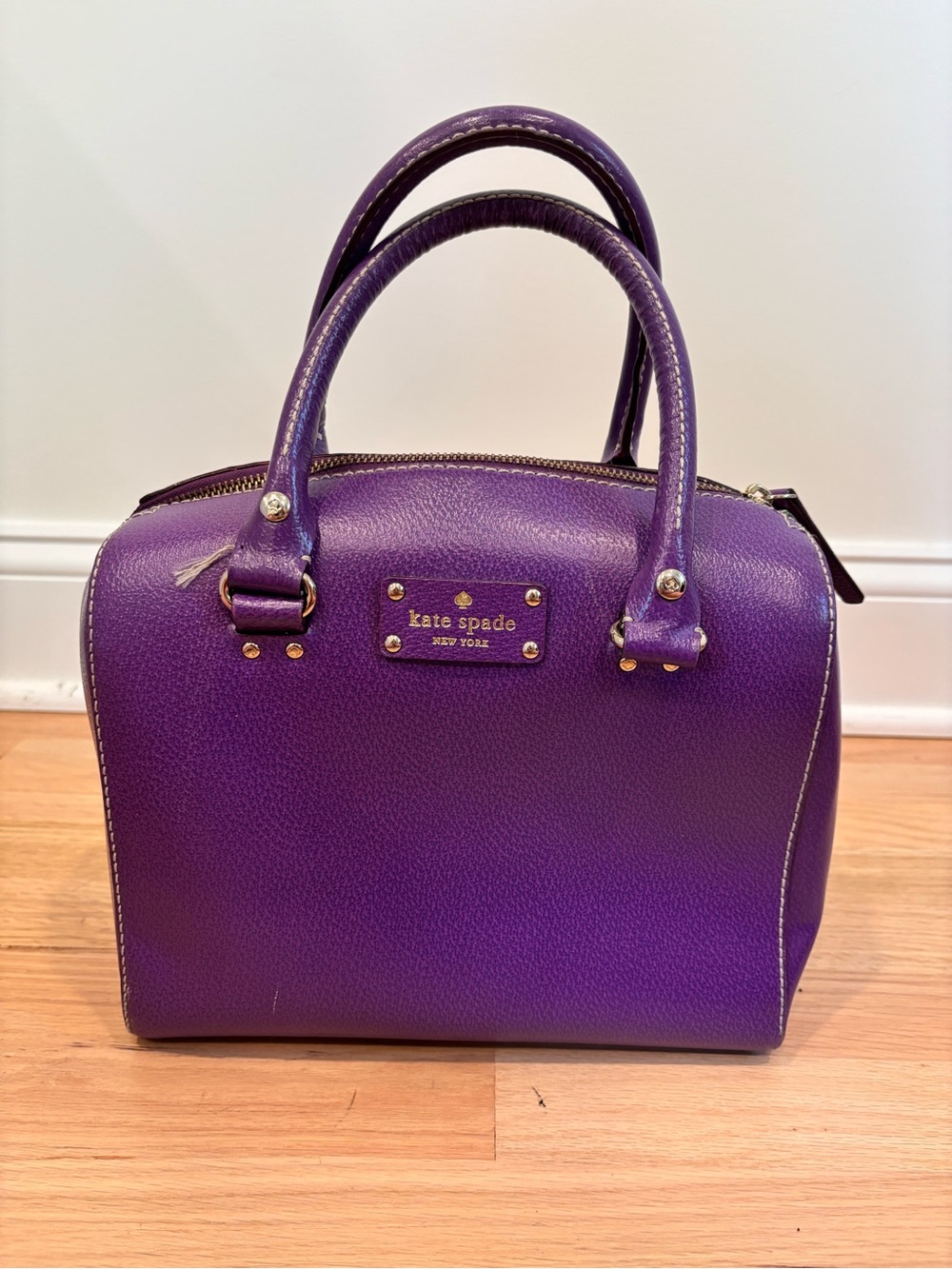 Kate Spade Alessa Wellesley handbag in a vibrant plumberry purple leather